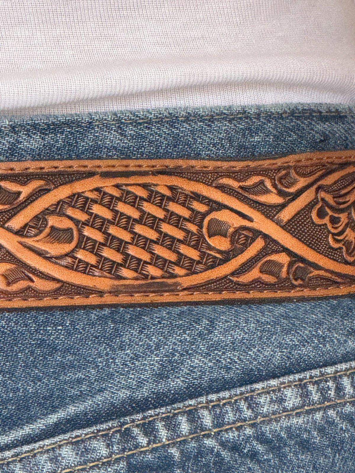 Vintage western belt tooled leather close-up
