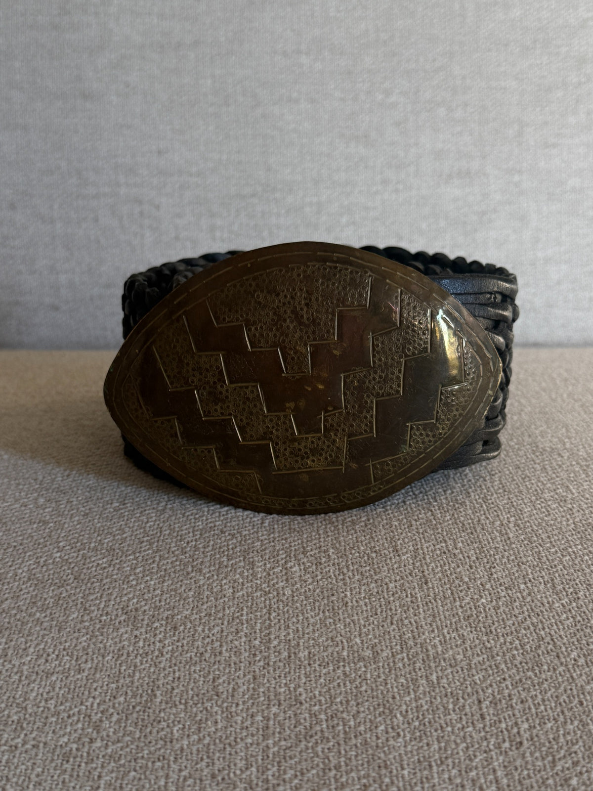 Vintage braided leather statement belt black buckle front view