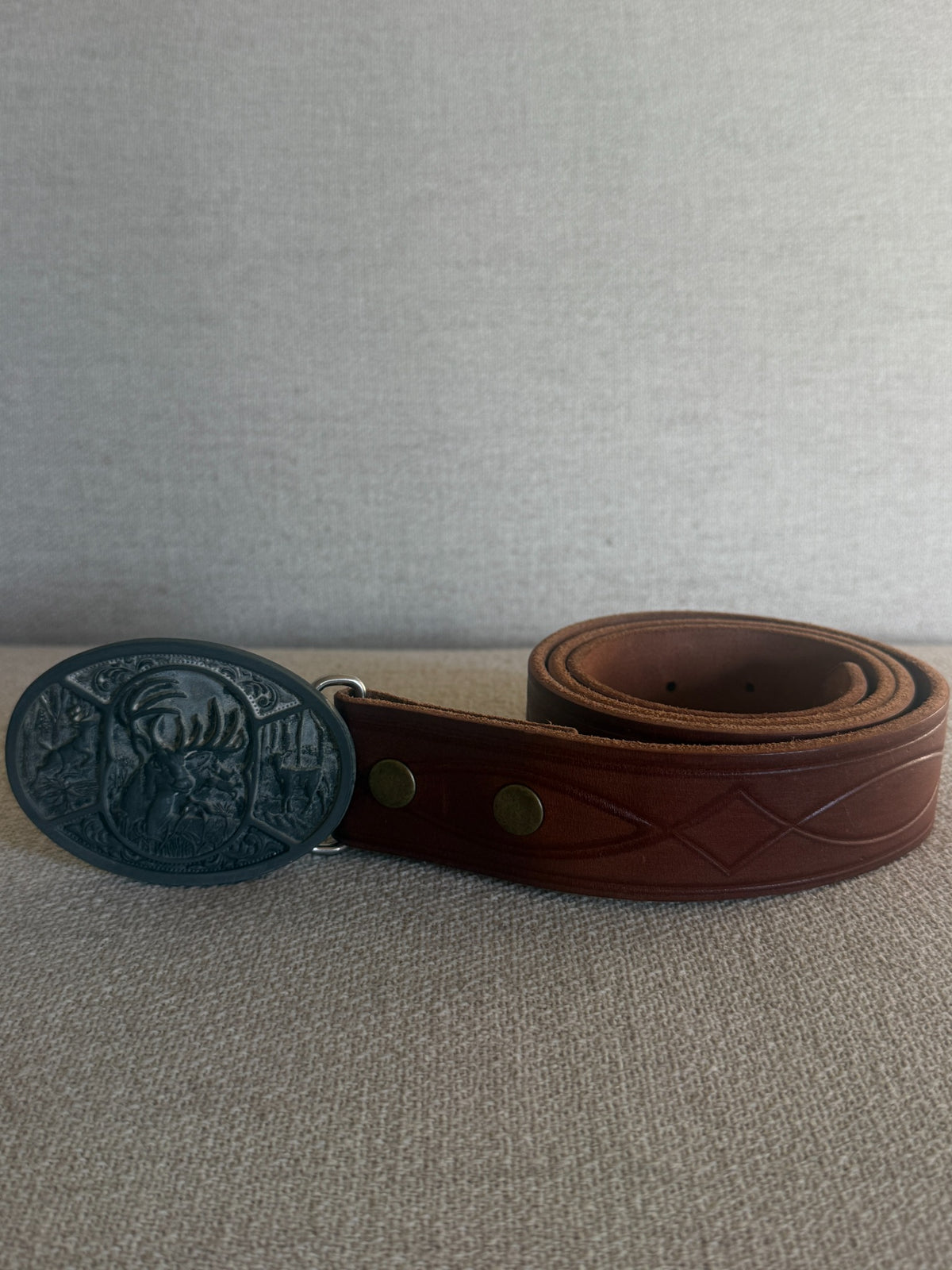Vintage Western leather belt brown rolled side view
