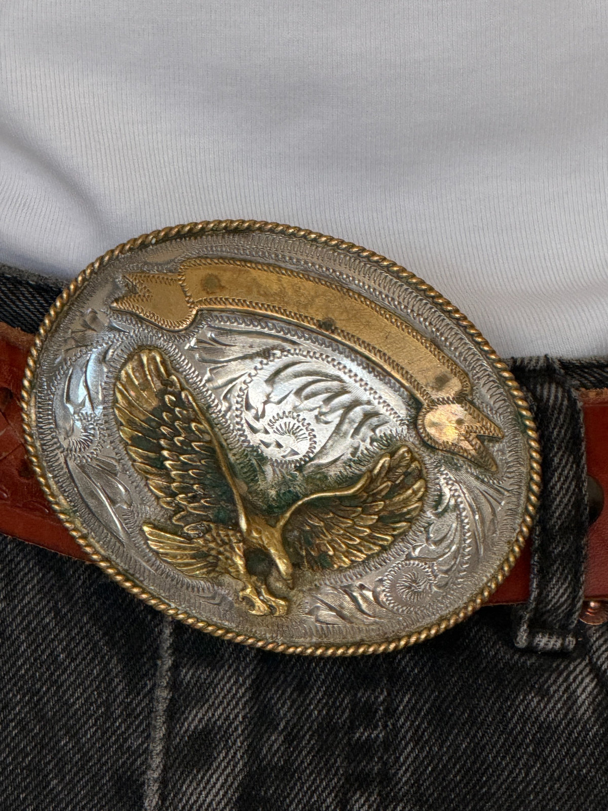 Vintage western leather belt brown eagle buckle close-up