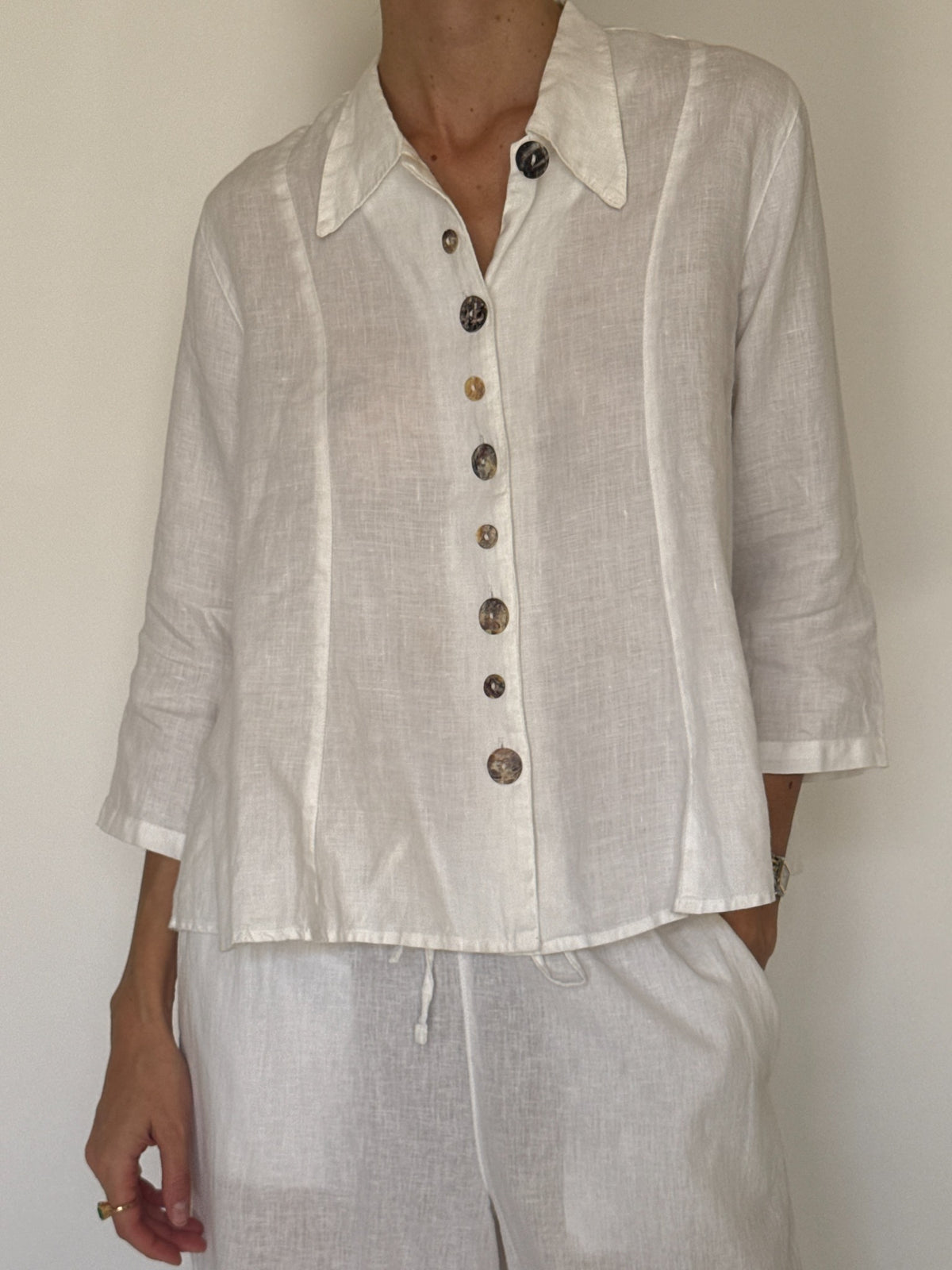 Vintage white linen button-front shirt with decorative marbled buttons