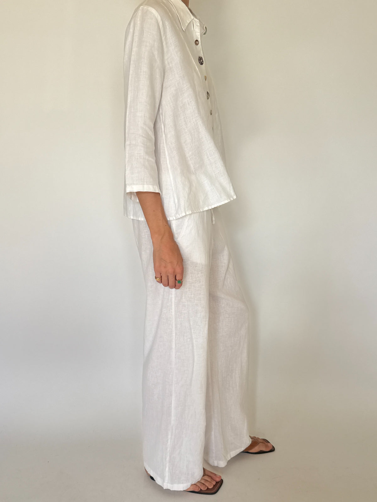 Vintage white linen button-front shirt with decorative marbled buttons