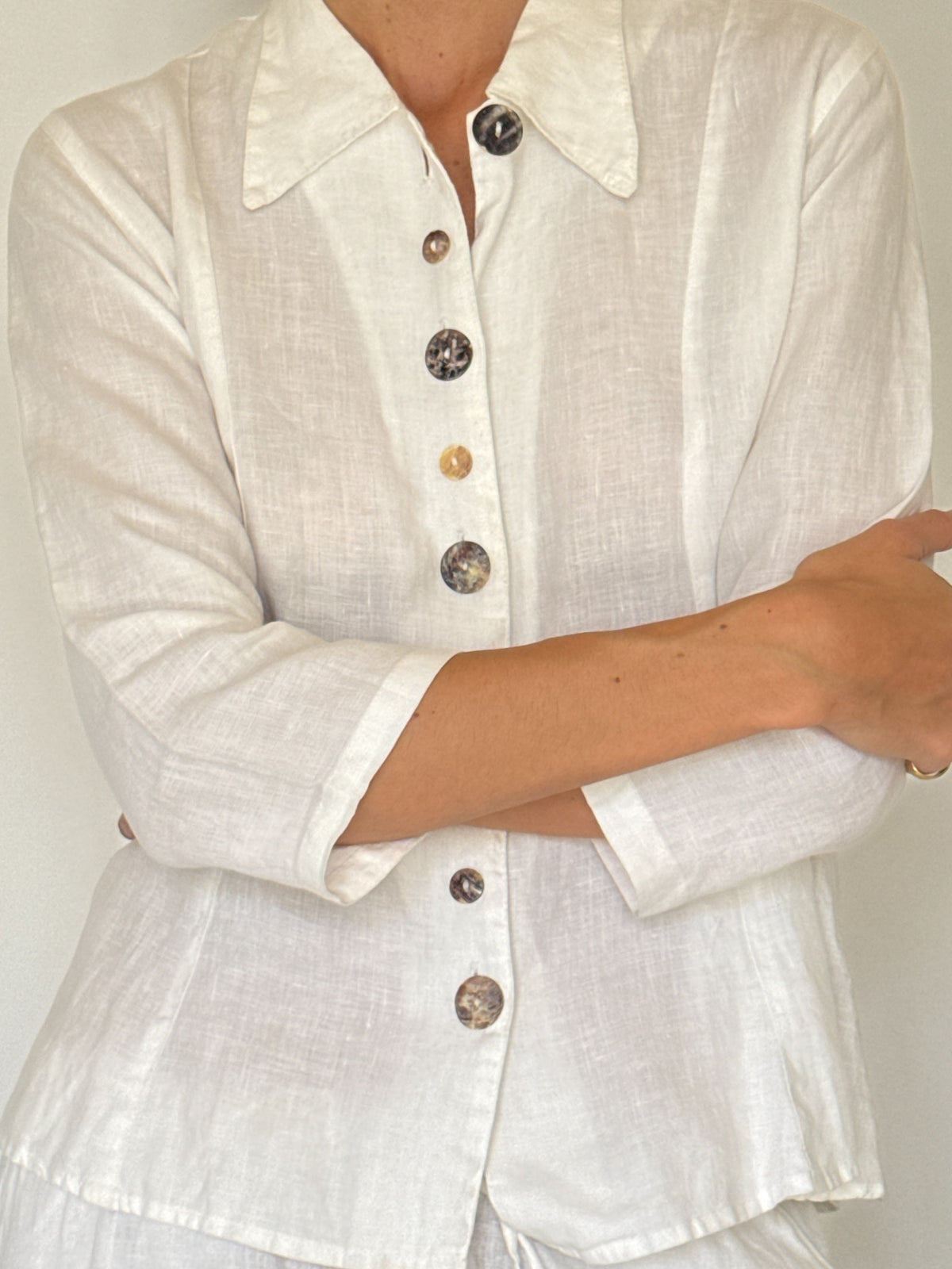 Vintage white linen button-front shirt with decorative marbled buttons